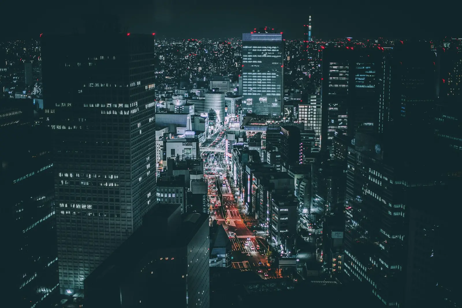 Aerial night view of a city grid lit up